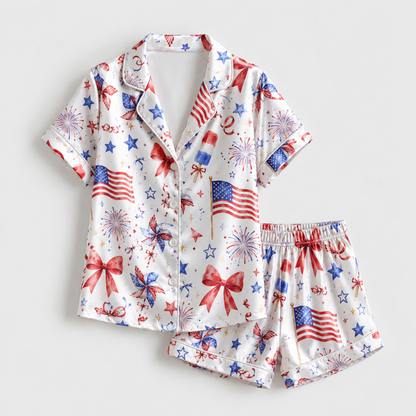 PJ-M006-White Satin Sleepwear Coordinate Featuring Patriotic Flags Fireworks Pinwheels And Festive Red Bows